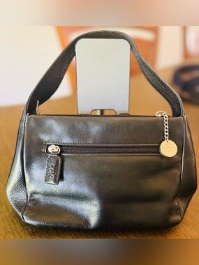 The Sak mini Black Leather Shoulder Bag with Front Zip and Charm
